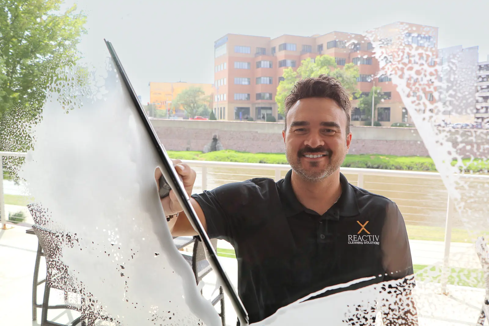 Reactiv Cleaning Solutions owner providing professional window cleaning service